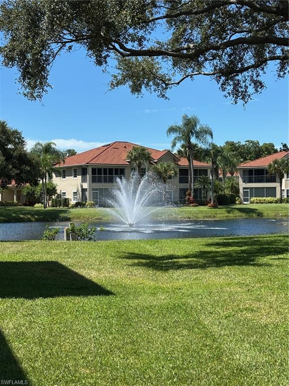 6225 Bellerive Avenue, Unit 1504 Naples, FL 34119 - Photo 2 of 18 a view of a house with a big yard
