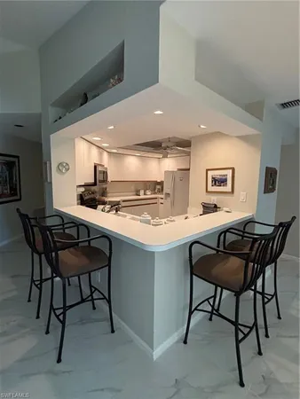 a kitchen with a table chairs and a stove