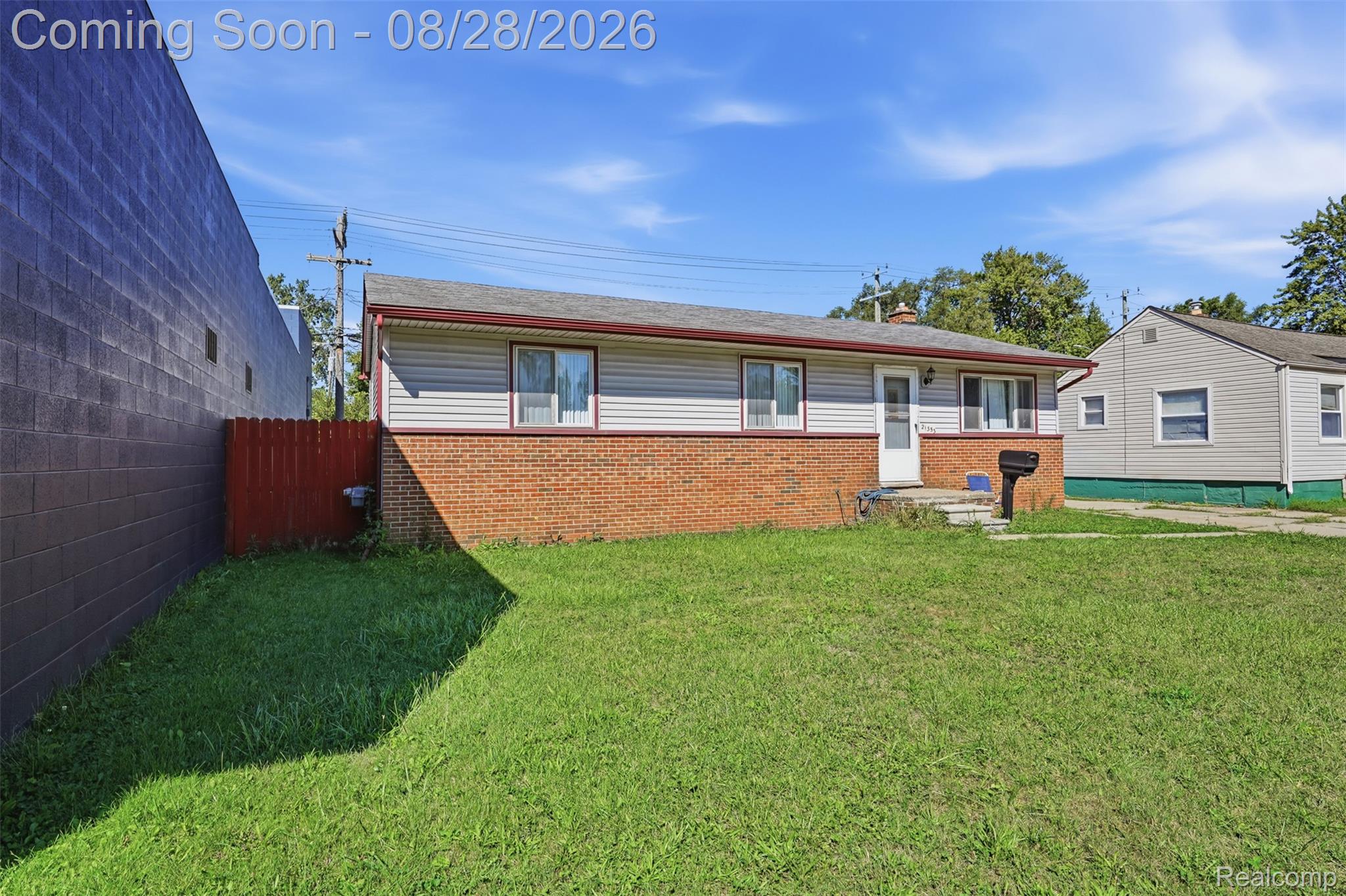 21353 Waltham Road Warren, MI 48089 - Photo 24 of 25 Ranch-style residence featuring a brick and siding exterior, front lawn, and a red fence along the property line