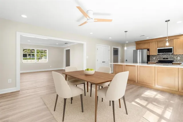 a bedroom with a bed and a potted plant