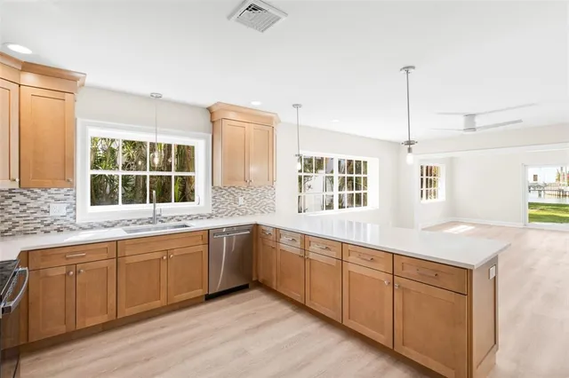 a view of entryway with wooden floor and stairs