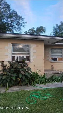 a house view with a garden space