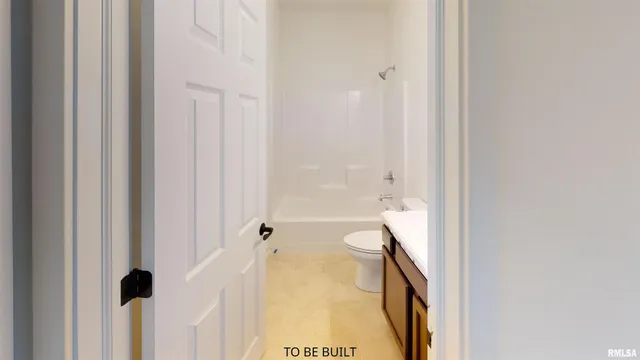 a view of a room with an empty space and a window