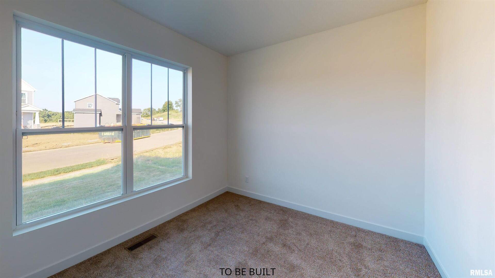 2-2 18th Avenue Silvis, IL 61282 - Photo 10 of 11 a view of an empty room with a window