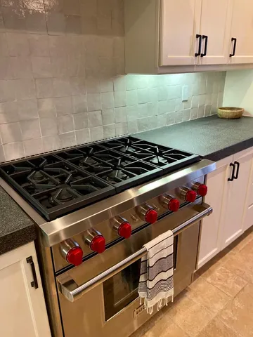 a bedroom with a bed and a mirror