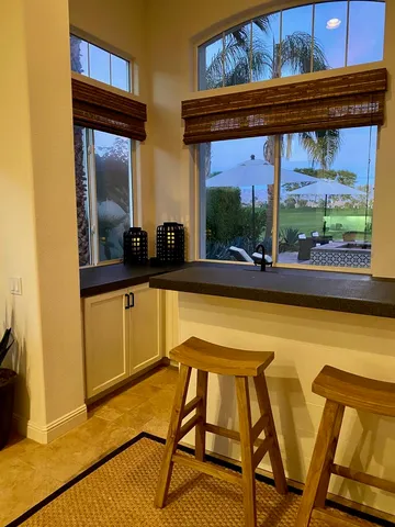 a bedroom with furniture and a potted plant