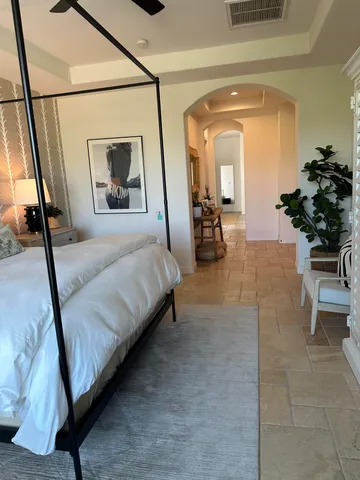 a bedroom with a bed and window