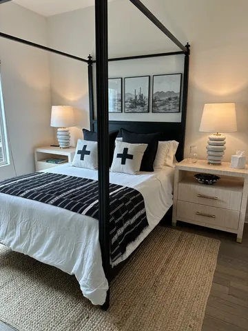 a view of a patio with table and chairs under an umbrella