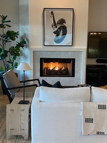 a kitchen with a sink a counter space appliances and cabinets