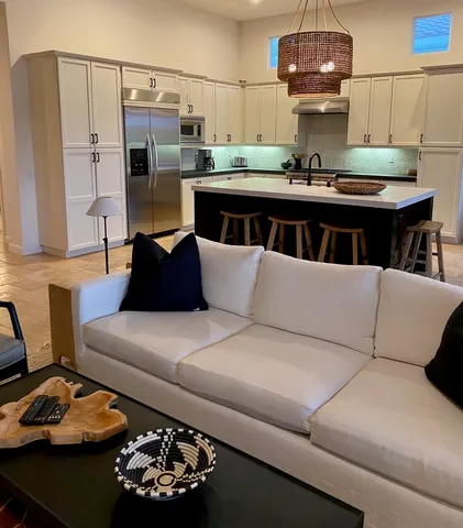 a view of a swimming pool and outdoor seating