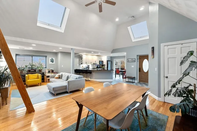 a living room with furniture a rug and a chandelier