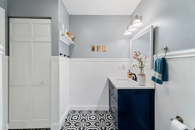 a bathroom with a sink and a mirror