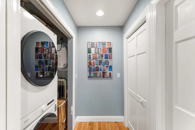 a view of a hallway with washer and dryer