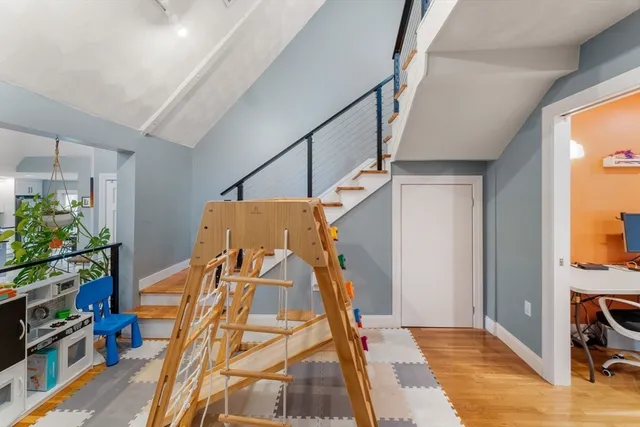a view of an entryway with wooden floor