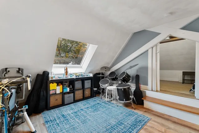 a living room with lots of furniture and a wooden floor