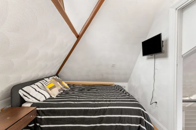 a view of an empty room and wooden floor