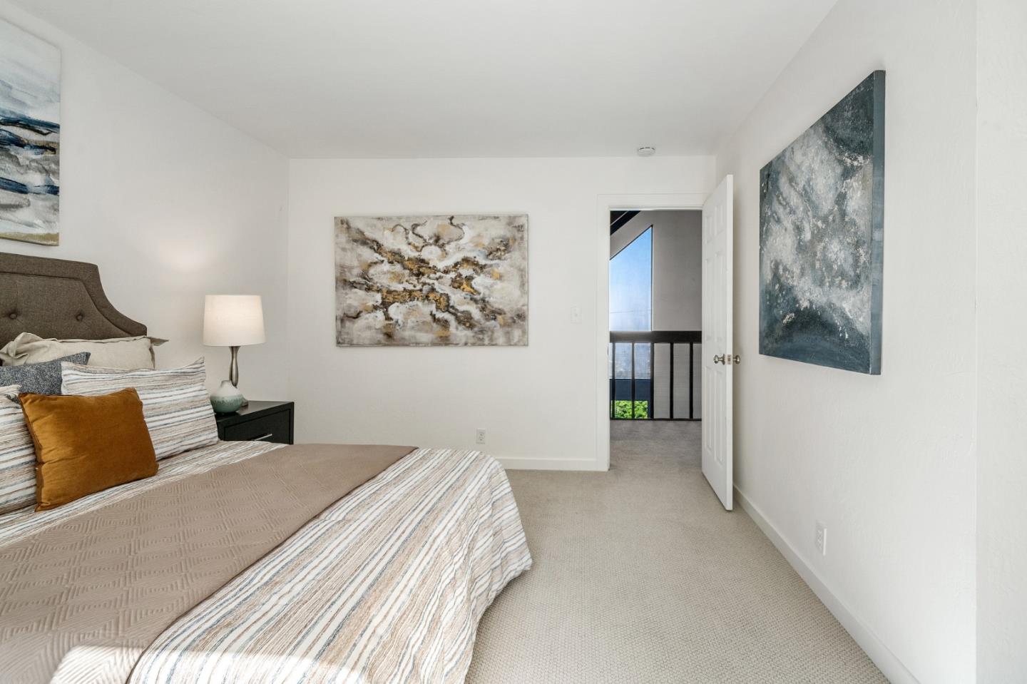 290 Olympian Way Pacifica, CA 94044 - Photo 21 of 33 a bedroom with a bed and a painting on the wall