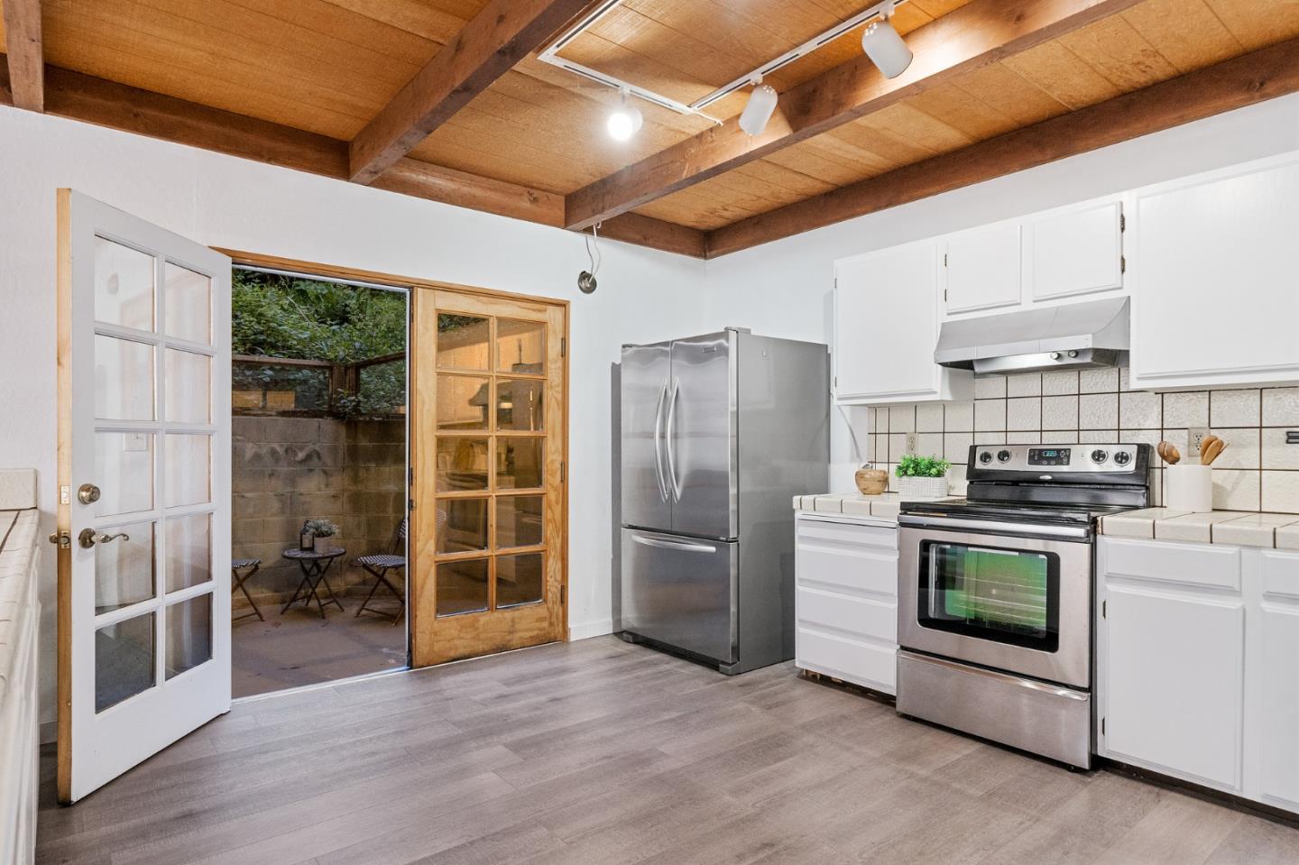 290 Olympian Way Pacifica, CA 94044 - Photo 30 of 33 a kitchen with stainless steel appliances granite countertop a stove and a refrigerator