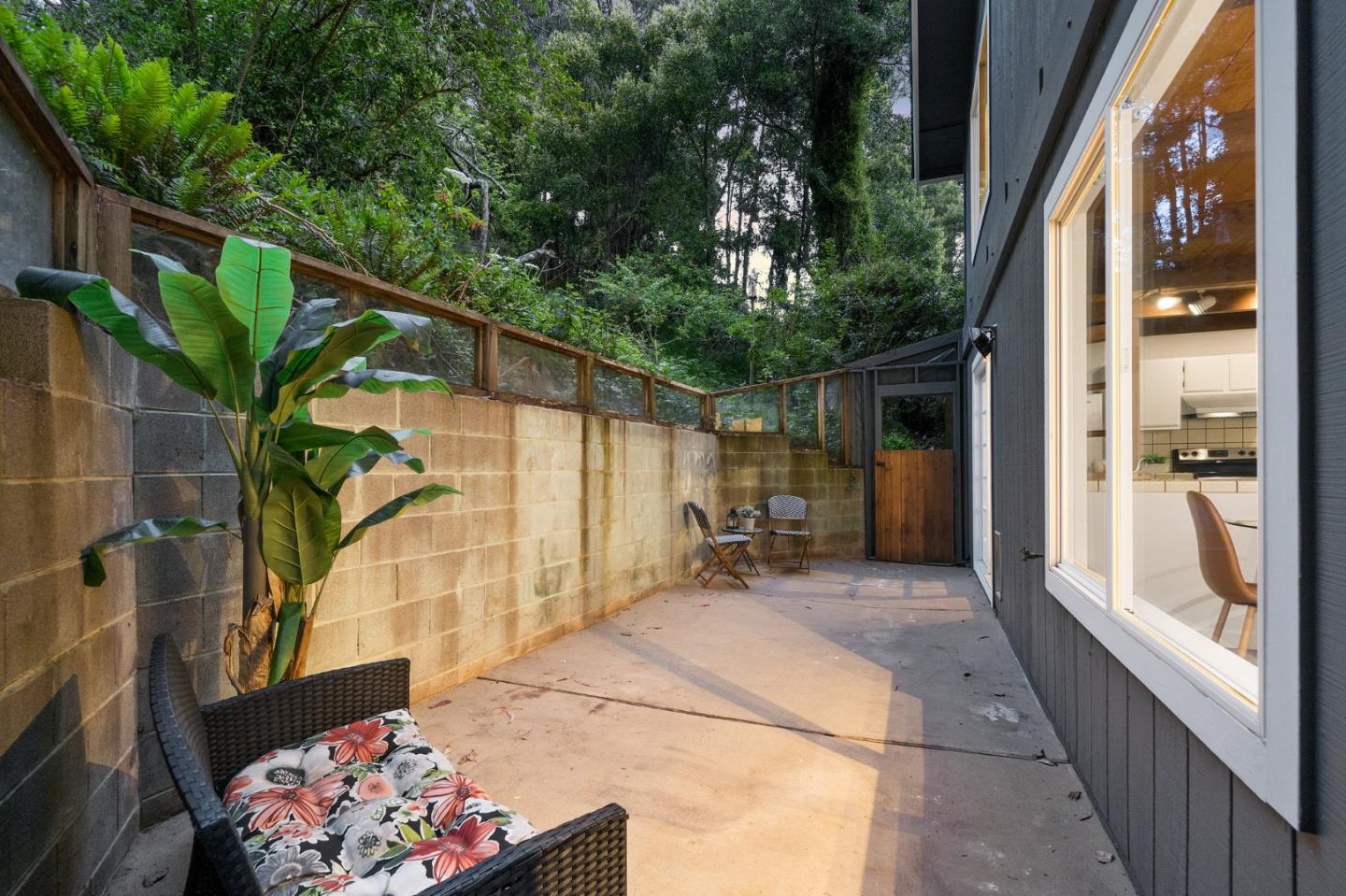 290 Olympian Way Pacifica, CA 94044 - Photo 32 of 33 a backyard of a house with table and chairs