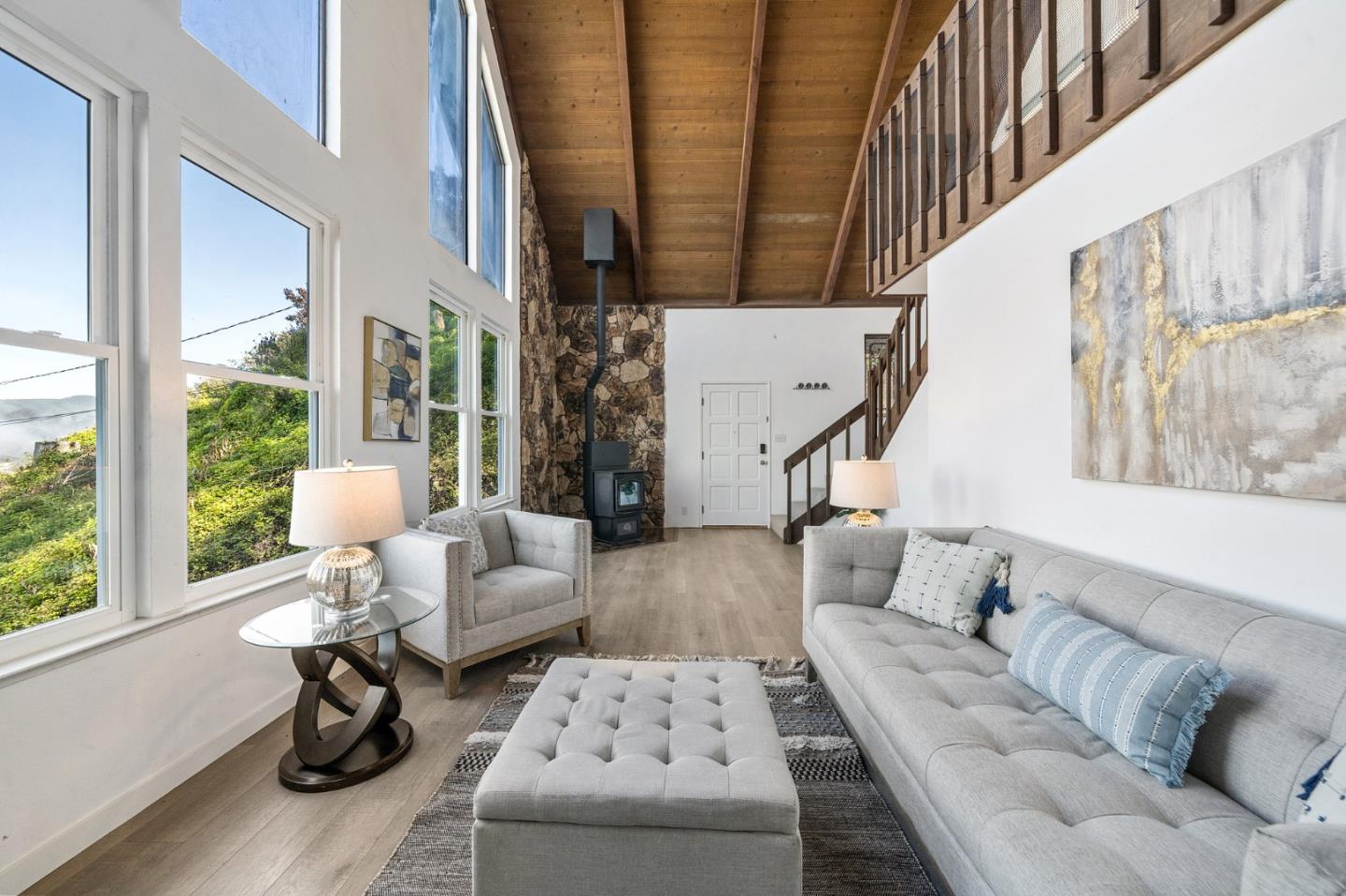 290 Olympian Way Pacifica, CA 94044 - Photo 6 of 33 a living room with furniture and a large window