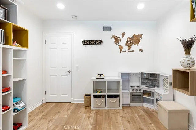 a view of a livingroom with furniture and a flat screen tv