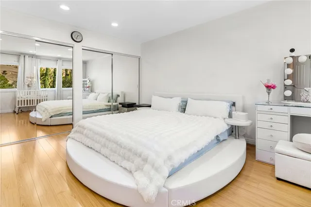 a large white bed in a white room