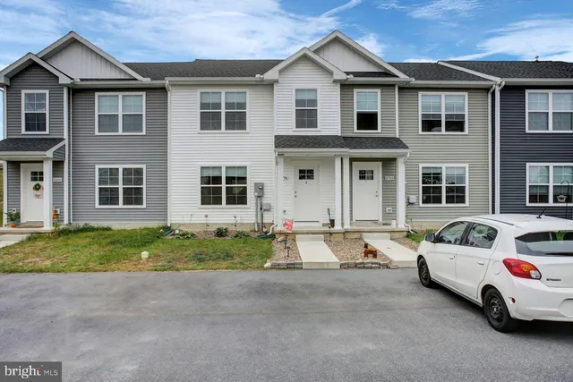 a view of multiple house with a yard