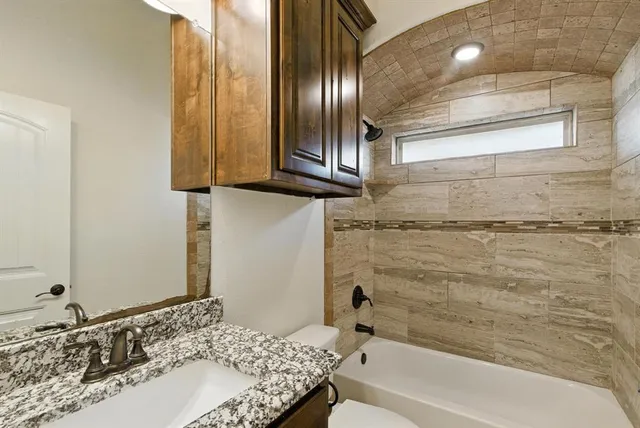 a bathroom with a sink and a bathtub