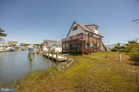a front view of a house with lake view
