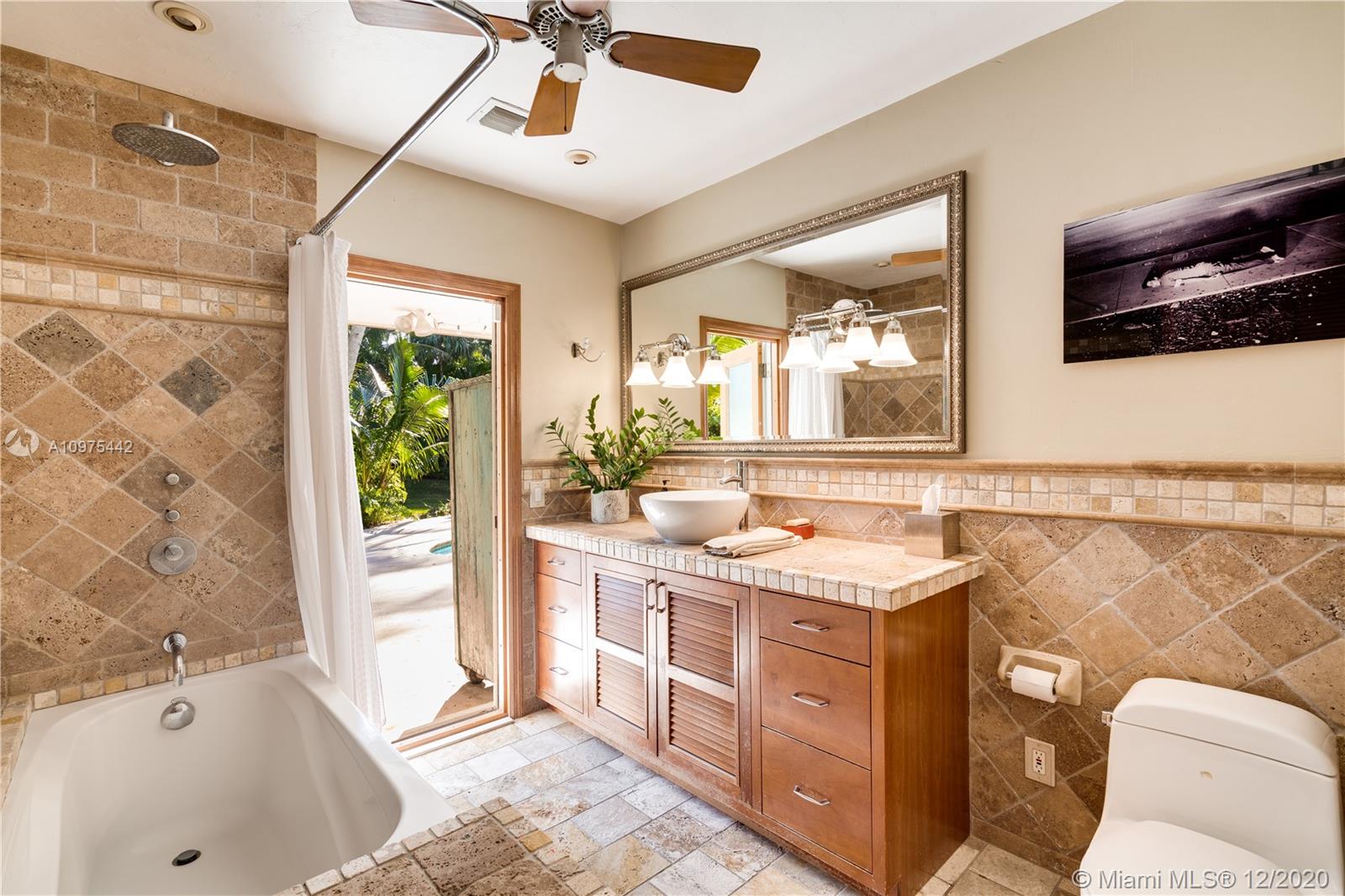 6100 Moss Ranch Road Pinecrest, FL 33156 - Photo 23 of 30 hall bathroom serving pool, main living areas and eastside bedroom