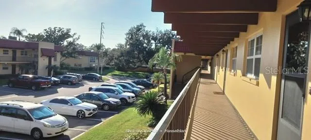 a view of swimming pool from a balcony
