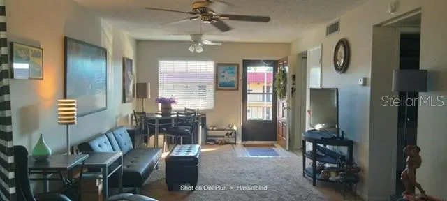 a view of a livingroom with furniture and windows