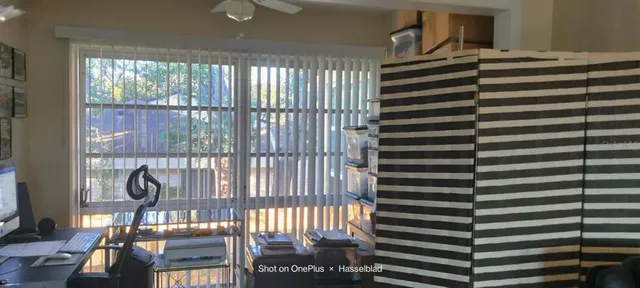 a view of a balcony with door and glass windows