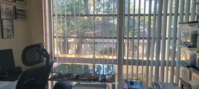 a room with outdoor view and a large window