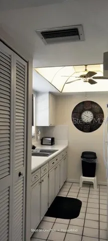 a kitchen with a sink and a stove