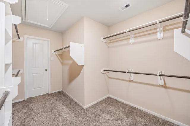 a view of an empty walk in closet