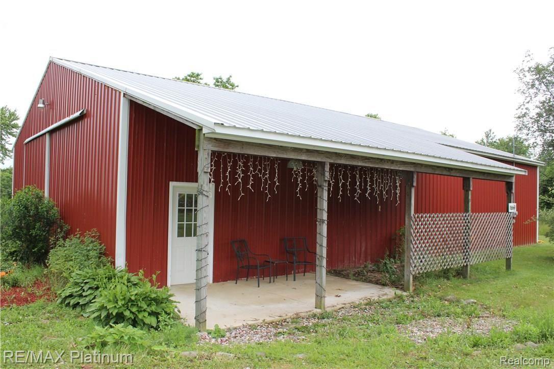 6691 Mabley Hill Road Fenton, MI 48430 - Photo 8 of 28 10x32 lean to provides perfect resting spot.