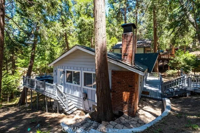 a view of a wooden deck front of house