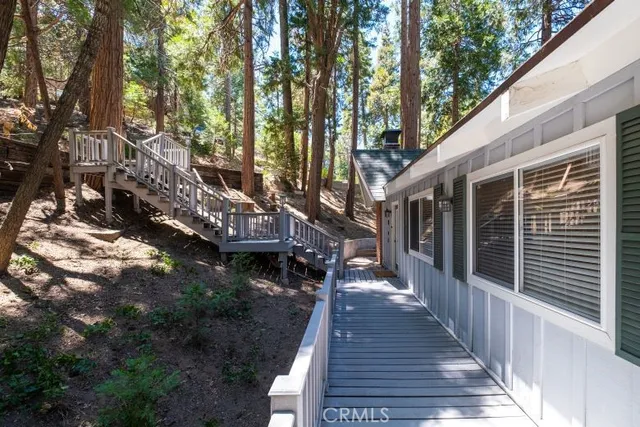 a view of stairs yard and patio