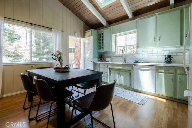 a view of a dining room with furniture and window