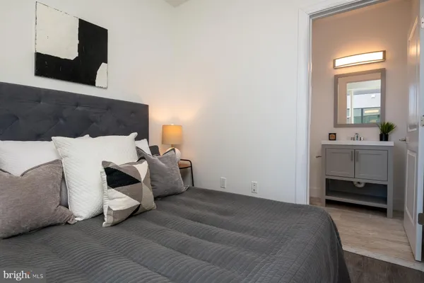 a bedroom with furniture and window