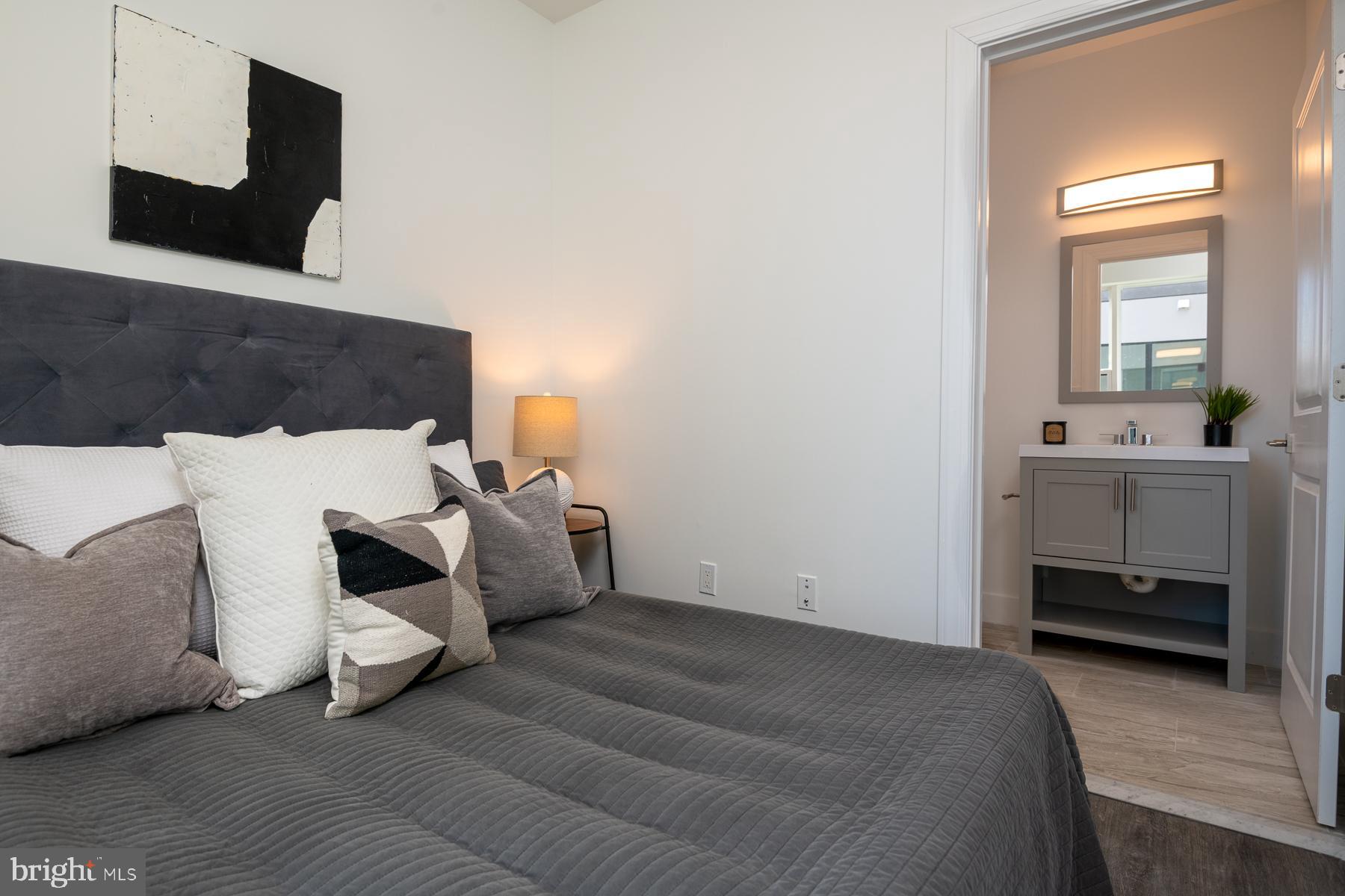 818 Bladensburg Road Northeast, Unit 203 Washington, DC 20002 - Photo 3 of 13 a bedroom with furniture and window