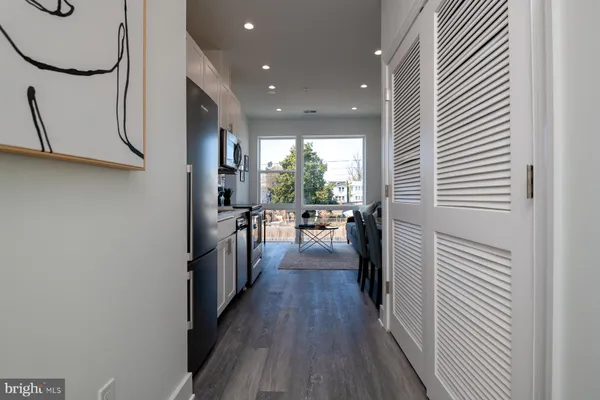 a view of a kitchen from the hallway