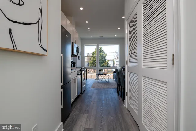 a view of a kitchen from the hallway