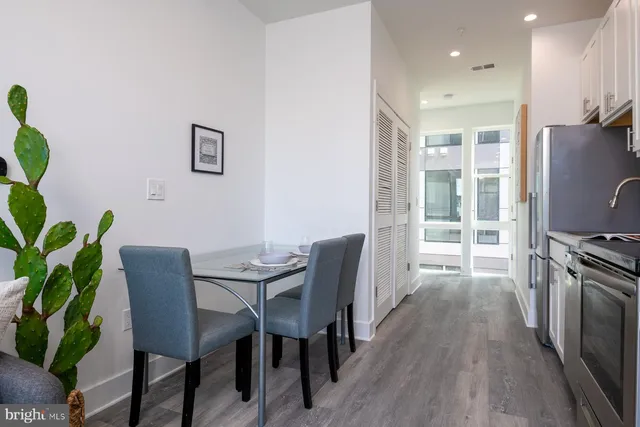 a view of a dining room with furniture window and wooden floor