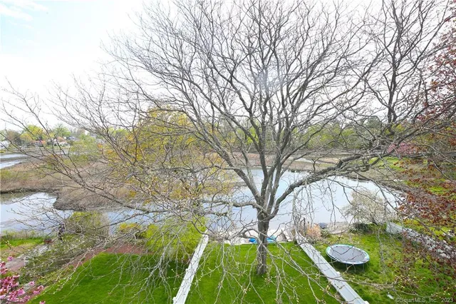 a backyard of a house with outdoor seating