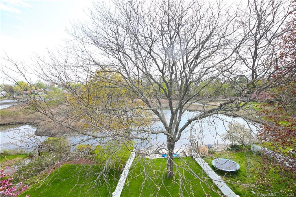 331 Riverside Drive Fairfield, CT 06824 - Photo 12 of 34 a backyard of a house with outdoor seating