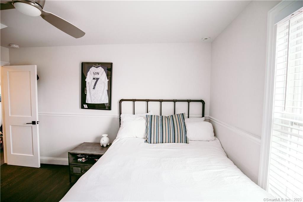 331 Riverside Drive Fairfield, CT 06824 - Photo 17 of 34 a large white bed in a white room