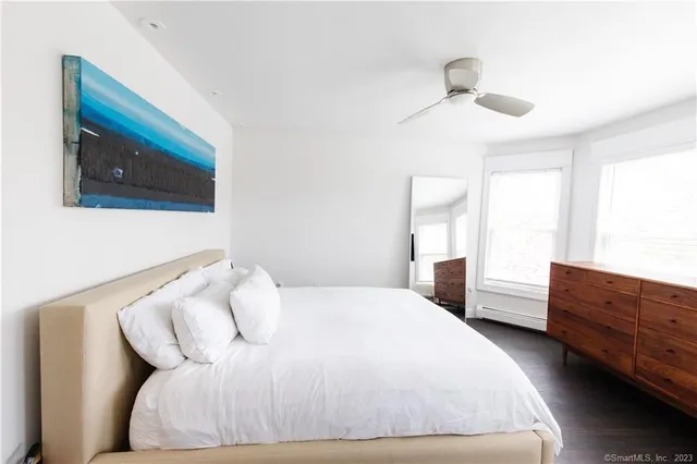 a bedroom with a bed and a dresser