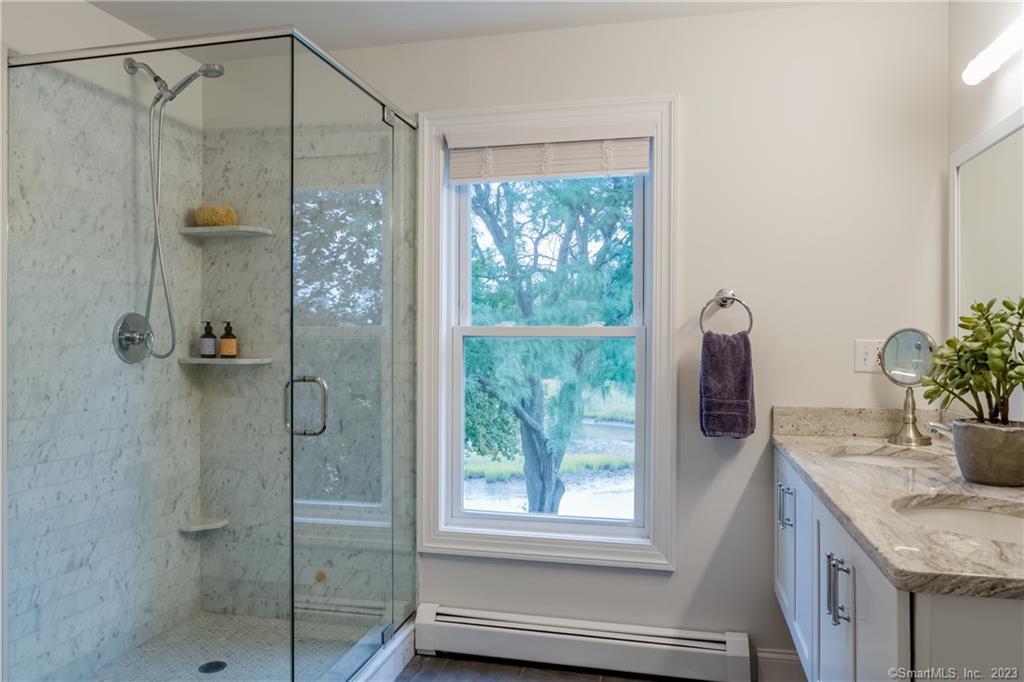 331 Riverside Drive Fairfield, CT 06824 - Photo 20 of 34 a bathroom with a shower and a sink
